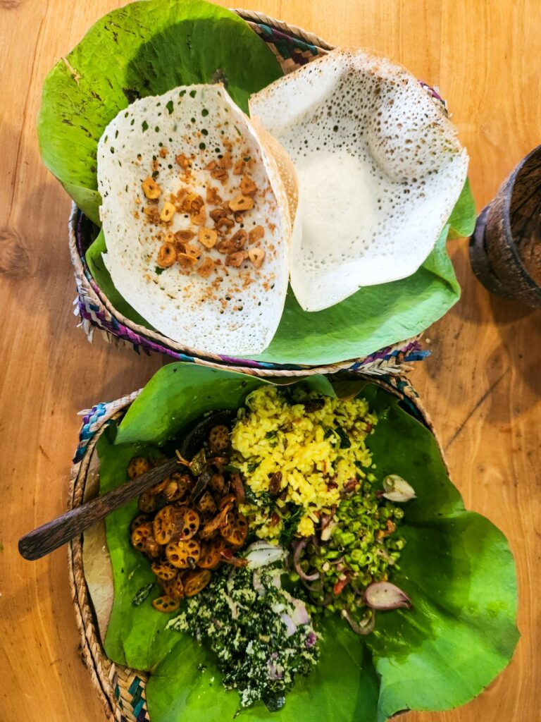 A Sri Lankan breakfast laid out on the table with several small dishes