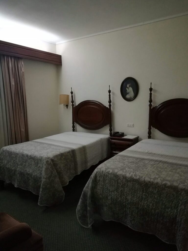 Family Room with two beds and wooden headboards